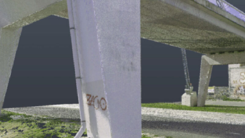 Detail van betonnen brugconstructie met kabels en graffiti, geschikt voor 3D-laserscanning van civiele infrastructuur